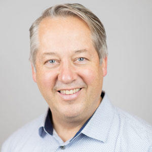 man with gray hair, smiling