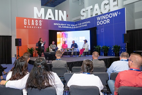 people listening to a panel session at Main Stage