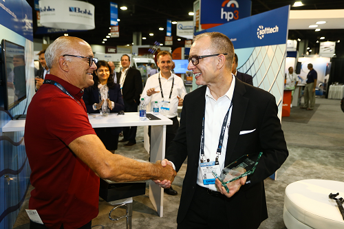 Guy Selinski shakes hands with Mitch Lewandowski of Softtech during the 2019 Best in Show Awards