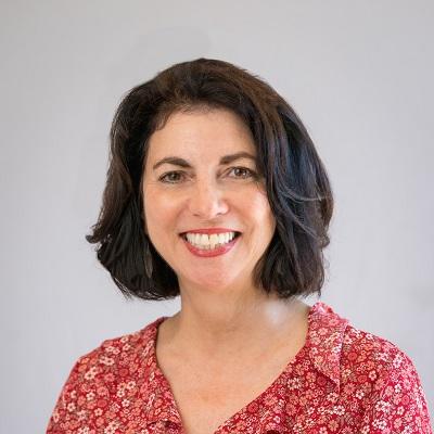Barbara Kotsos. Woman with short dark hair, smiling